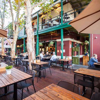 Relax outdoors and dine with friends at Queens Tavern